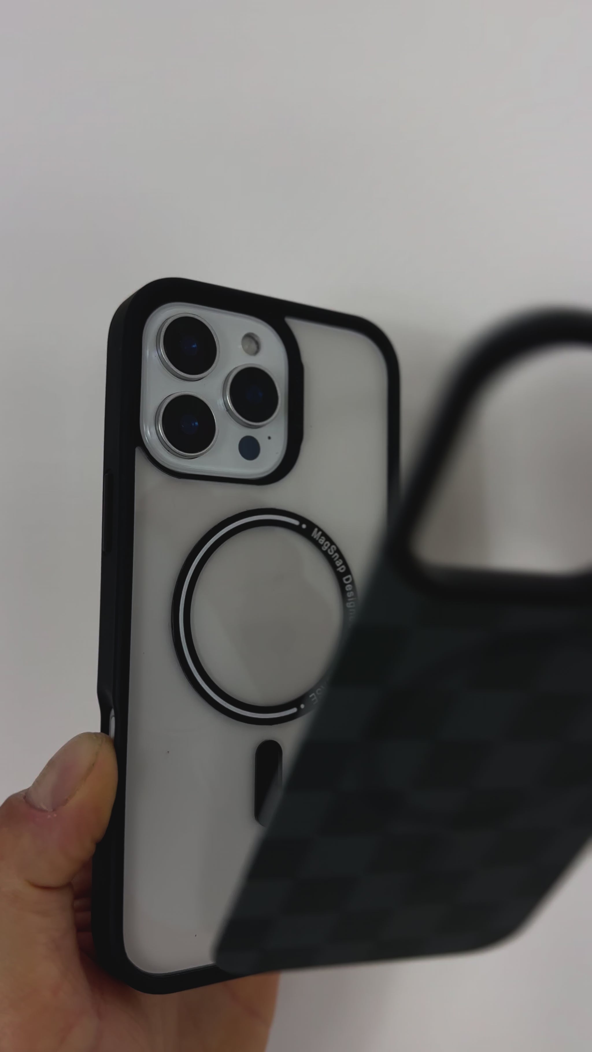 Tough MagSafe® iPhone Case with Black Checkered MagSnap™ cover, showing snap-on design and MagSafe® compatibility.