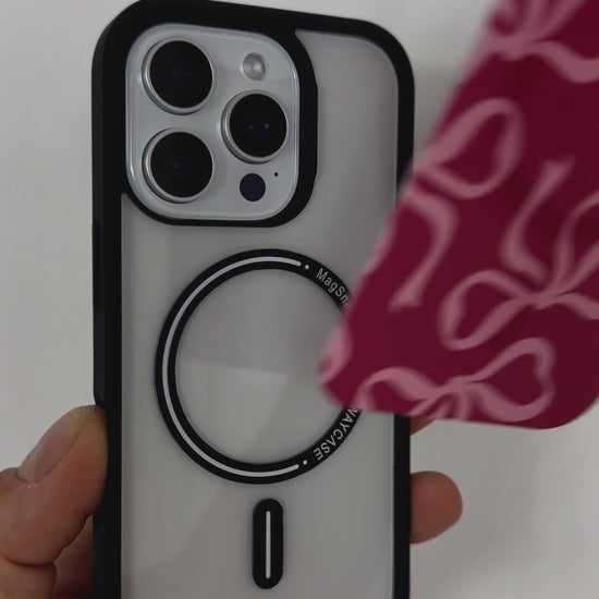 Video showcasing the Tough MagSafe® iPhone Case with MagSnap™ Pink Bows design, featuring delicate pink bow patterns on a magnetic back cover. Demonstrates easy snap-on interchangeability, stylish personalisation, and secure MagSafe® compatibility.