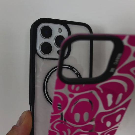 Video showcasing the Tough MagSafe iPhone Case in MagSnap pink, featuring an abstract faces design. SHowcasing the product, highlighting its vibrant colour, artistic pattern, and MagSafe compatibility.