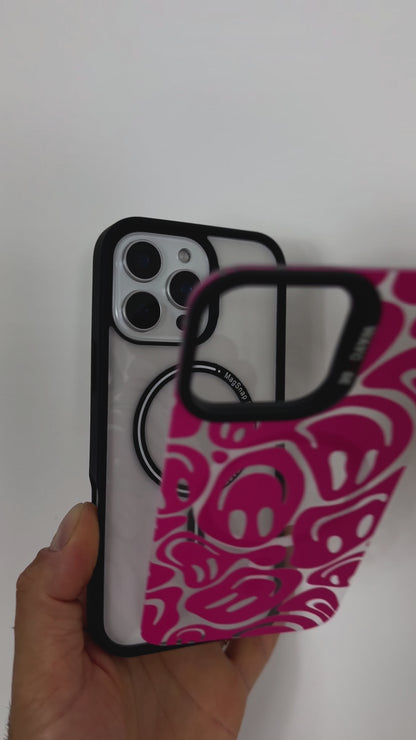 Video showcasing the Tough MagSafe iPhone Case in MagSnap pink, featuring an abstract faces design. SHowcasing the product, highlighting its vibrant colour, artistic pattern, and MagSafe compatibility.