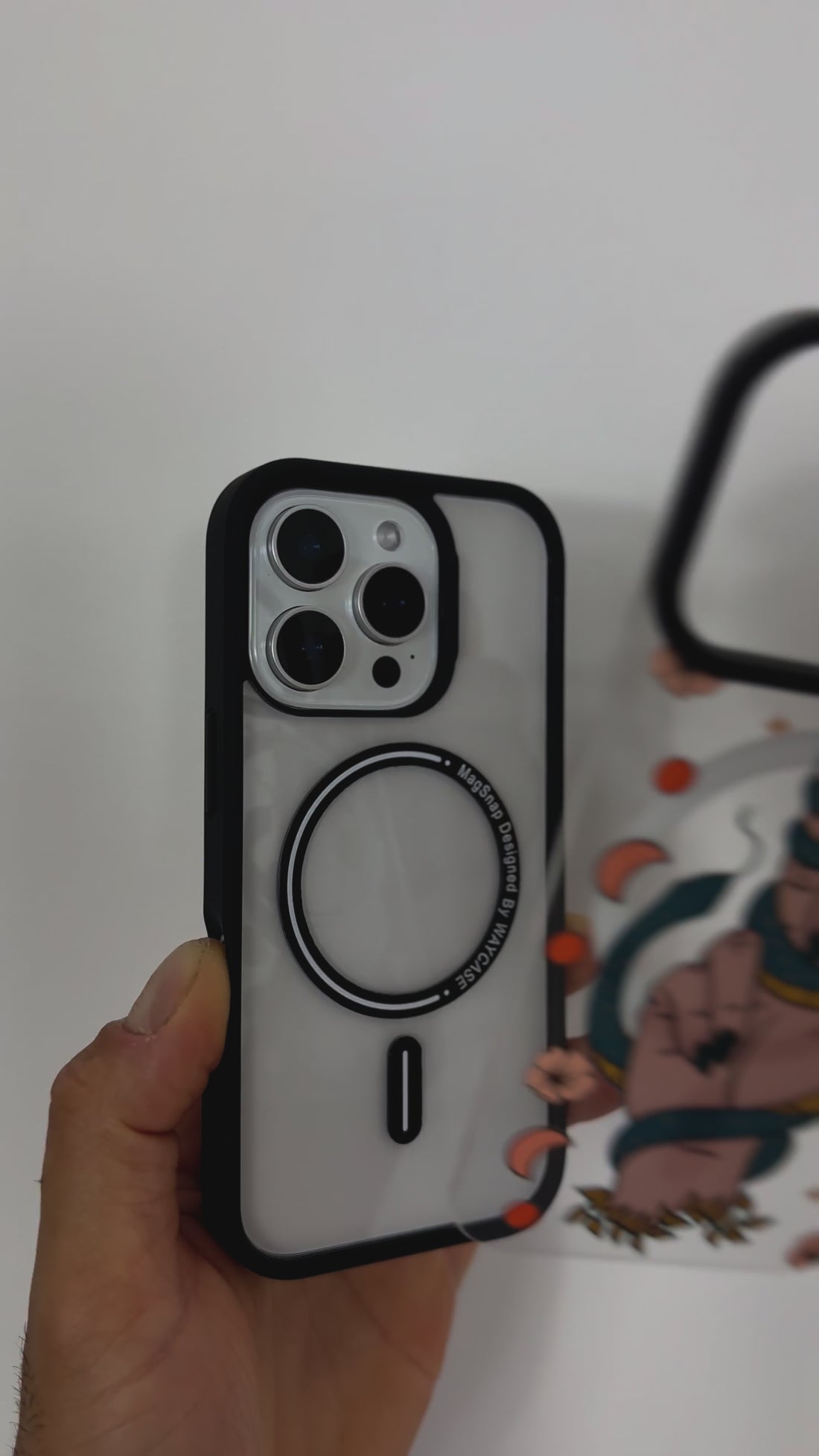 Video highlighting the Tough MagSafe® iPhone Case with MagSnap™ Eve's Curse design, featuring a bold, symbolic graphic on a magnetic back cover. Demonstrates the case’s easy snap-on customisation, durable protection, and full MagSafe® compatibility.